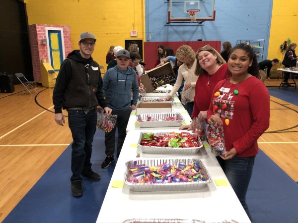  In the first station of the process, volunteers assemble the candy. “The holidays are a reminder of the importance of spreading kindness and compassion to others that should be shared throughout the whole year,” co-chair of Centric Solutions Group Cynthia Karrandja said. In 2023, the group collected $4,300 worth of Christmas treat bags.