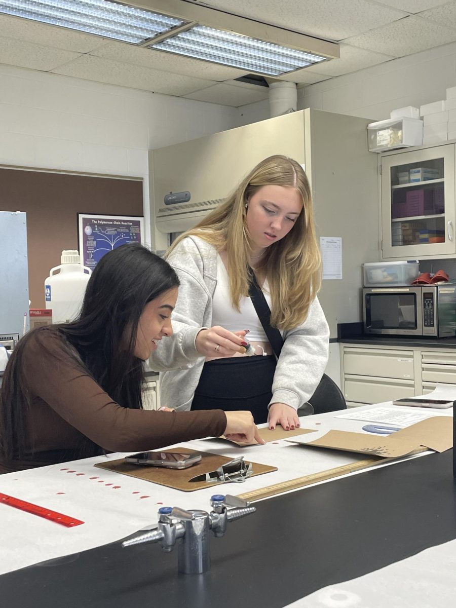 At Lawrence Technology University, senior Madison Green and junior Maryam Al Quraishi drop and measure blood drops. “We were having fun because we weren't taking it seriously, nobody was,” Green said. Madison enjoyed missing school and instead learning about blood.
