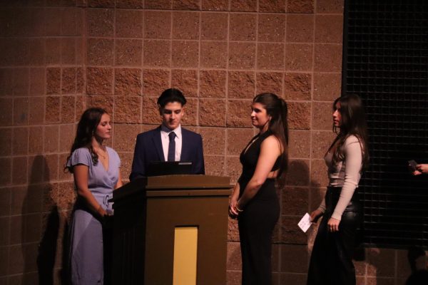 At the NHS ceremony in 2023, president senior Mekhi Kattula showcases the newest members with vice president senior Evangelina Danforth and junior Maya Azar who is the current president now.  “So it just makes me feel proud of them, and it's fun that I get to watch it. It's our formal induction ceremony that allows all the juniors to become official members of NHS,” Azar said.
