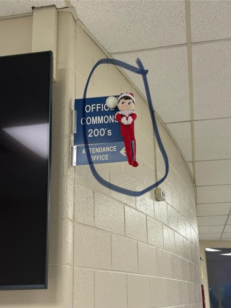 Ike, the elf, is placed on a sign before school for students to find. Every morning, administrative assistant Sandra Austin hides the elf and the first student to email her a picture of the elf wins a prize. “I think it will last a long time. Elves were really popular,” senior Sandra Dawood said.