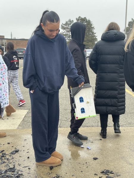 In the school parking lot, senior Kayla Livingston looks at the aftermath of the burning houses. “I think it turned out good. My friend and I worked on it for a while. We put a lot of decorations in it. It burned very well, weirdly.” She wishes she would have built the house instead of buying one if she could go back and do it again.