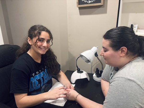 Junior Liliana Tannous gives her cousin a fresh new set of nails. After each set, she posts on her Instagram the finishing products 