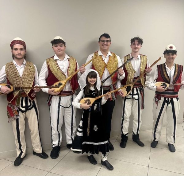 Senior Christian Sinishtaj and his group “Sound of the Çifteli” after their performance on Nov. 28, for Albanian Independence Day. The group traveled and performed together throughout Michigan, often in front of hundreds or even thousands of people. “It’s a great feeling, being able to perform with my friends and share our culture,” Sinishtaj said.
