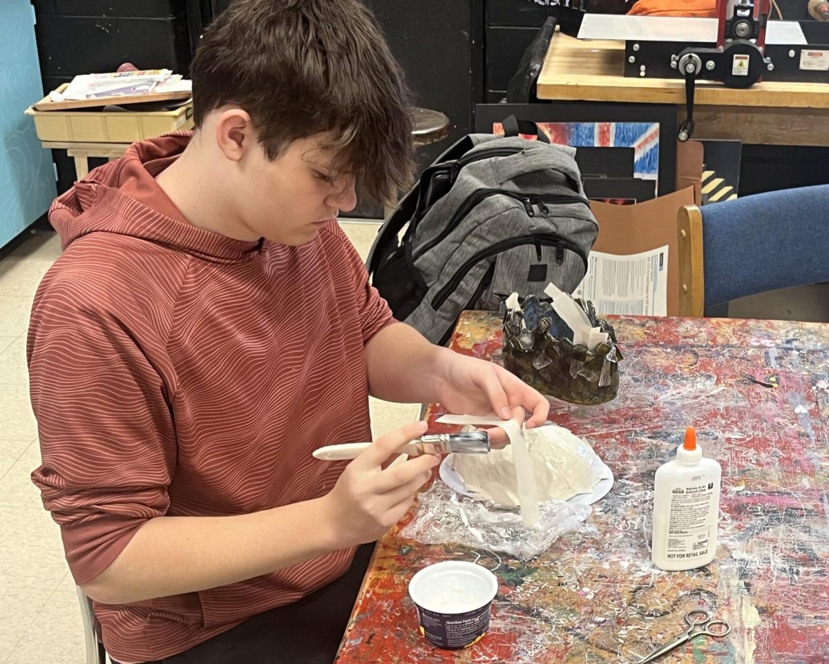 Bringing an idea to life, senior sculpture student Braden Williams begins construction on a book-based sculpture. The sculpture concept revolves around fortune telling, which Williams will evoke with a head sculpt, sporting a third eye. “It's [the eye] a bigger focus on that face. It's the main focus. Gotta put a lot of detail into that,” Williams said.
