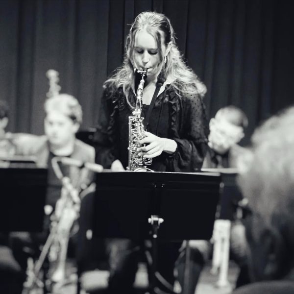 Preforming on stage, senior Helen Kangas plays the saxophone with her civic jazz orchestra team. "I feel really happy when we're playing, Especially as a senior we're playing more emotional music," Kangas said.  She has playing jazz for two years.