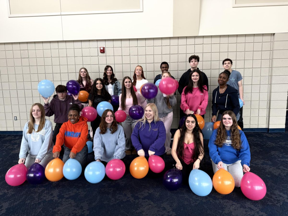 The yearbook staff set up some balloons to throw to celebrate their finals deadline before spring sports.