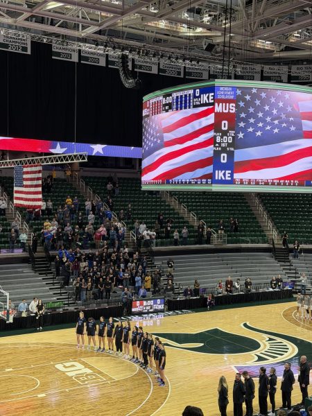 Women's Varsity Basketball plays in the state semi-finals against Muskegon in East Lansing at the Breslin Center. They lead after the first quarter 14-13.